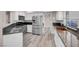 Updated kitchen with stainless steel appliances, granite countertops, and white cabinetry at 42 Megan Dr, Henderson, NV 89074