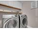 Convenient laundry room equipped with modern, stainless steel washer and dryer units at 42 Megan Dr, Henderson, NV 89074