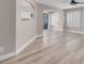 Spacious living area with wood-look floors and an archway leading to other rooms at 42 Megan Dr, Henderson, NV 89074