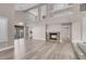 Spacious living room with vaulted ceilings, a fireplace, and sliding glass doors to the backyard at 42 Megan Dr, Henderson, NV 89074