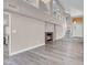 Open-concept living area showcasing the fireplace, wood floors, and staircase to the second floor at 42 Megan Dr, Henderson, NV 89074