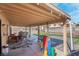 Covered patio includes dining set and a playground at 42 Megan Dr, Henderson, NV 89074