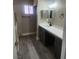 Bathroom featuring modern vanity with a white countertop and cabinets at 4536 Payson Ave, Las Vegas, NV 89115