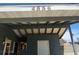 A sheltered carport with a white door featuring the home's street number: 4536 at 4536 Payson Ave, Las Vegas, NV 89115
