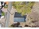 Aerial view of mountain home with metal roof, small yard, and street access at 4578 Yellow Pine Ave, Mount Charleston, NV 89124
