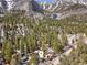 Aerial view of peaceful mountain community nestled among the trees with views of mountains at 4578 Yellow Pine Ave, Mount Charleston, NV 89124