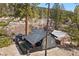 Aerial view of the home featuring a fenced yard and beautiful greenery at 4578 Yellow Pine Ave, Mount Charleston, NV 89124