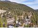 Aerial view of cozy mountain home nestled in a wooded area, offering privacy and tranquility at 4578 Yellow Pine Ave, Mount Charleston, NV 89124