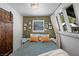 Comfortable bedroom with rustic wood accent wall, natural lighting and decor at 4578 Yellow Pine Ave, Mount Charleston, NV 89124