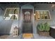 Inviting entryway with a decorative door, stylish accents, and a welcoming mat, enhancing the home's curb appeal at 4578 Yellow Pine Ave, Mount Charleston, NV 89124