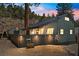 Charming home featuring distinctive architecture, a fenced yard, and mature trees, offering a serene and inviting atmosphere at 4578 Yellow Pine Ave, Mount Charleston, NV 89124