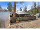 Home exterior featuring a fenced yard and gravel driveway at 4578 Yellow Pine Ave, Mount Charleston, NV 89124