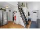 Open floorplan featuring ladder to loft, stainless appliances, and natural light at 4578 Yellow Pine Ave, Mount Charleston, NV 89124