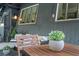 Inviting outdoor patio with wood furniture, plants, and a charming, cozy atmosphere at 4578 Yellow Pine Ave, Mount Charleston, NV 89124