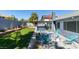 Backyard featuring a covered patio, artificial turf, and modern outdoor seating area at 4731 Torrence Dr, Las Vegas, NV 89103