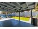 Spacious backyard featuring a covered patio, artificial turf, and desert landscaping at 4731 Torrence Dr, Las Vegas, NV 89103