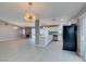Modern kitchen with stainless steel appliances, quartz countertops, a breakfast bar and stylish backsplash at 4731 Torrence Dr, Las Vegas, NV 89103