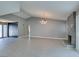 Large living room with modern lighting, vaulted ceilings, gray walls and a decorative fireplace at 4731 Torrence Dr, Las Vegas, NV 89103