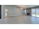 Bright living room with a decorative fireplace, sliding glass doors, and modern flooring at 4731 Torrence Dr, Las Vegas, NV 89103