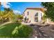 Large backyard with a well-maintained lawn, patio, and mature trees, perfect for outdoor enjoyment at 4817 Friar Ln, Las Vegas, NV 89130