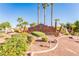 Entrance to Los Prados Golf Community & Country Club with lush landscaping at 4817 Friar Ln, Las Vegas, NV 89130