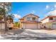Charming two-story home featuring desert landscaping and a two-car garage in a residential neighborhood at 4817 Friar Ln, Las Vegas, NV 89130
