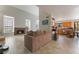 Spacious living room with a cozy fireplace and seamless access to the kitchen at 4817 Friar Ln, Las Vegas, NV 89130