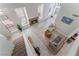 Bright, spacious living area with high ceilings, fireplace, and open staircase at 4817 Friar Ln, Las Vegas, NV 89130