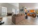 Spacious living room with a cozy fireplace and seamless access to the kitchen at 4817 Friar Ln, Las Vegas, NV 89130