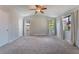 Spacious main bedroom with neutral walls and carpet flooring, and large windows at 4817 Friar Ln, Las Vegas, NV 89130
