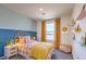 Colorful ' bedroom with a cute headboard and sunny yellow accents at 4828 Lilac Ridge Ave # 26, Las Vegas, NV 89141