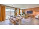 Open dining area featuring a modern table set and sliding glass doors to outside at 4828 Lilac Ridge Ave # 26, Las Vegas, NV 89141