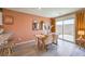 Dining area with modern table set and sliding door access to the backyard at 4828 Lilac Ridge Ave # 26, Las Vegas, NV 89141