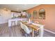 Bright dining area with kitchen bar, a wooden table with seating, and stylish decor at 4828 Lilac Ridge Ave # 26, Las Vegas, NV 89141