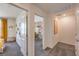 Upstairs hallway with carpet flooring and access to the bedrooms and natural light at 4828 Lilac Ridge Ave # 26, Las Vegas, NV 89141