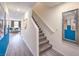 Inviting hallway with stairs leading to the upper level and a glimpse into the comfortable living area at 4828 Lilac Ridge Ave # 26, Las Vegas, NV 89141