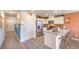 Modern open kitchen featuring stainless steel appliances and breakfast bar seating at 4828 Lilac Ridge Ave # 26, Las Vegas, NV 89141