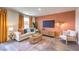 The living room features hardwood floors, a neutral-colored sofa, and an entertainment center at 4828 Lilac Ridge Ave # 26, Las Vegas, NV 89141