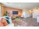 Bright living room features hardwood floors, TV, and modern decor with stylish rug at 4828 Lilac Ridge Ave # 26, Las Vegas, NV 89141
