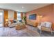 Cozy living room with stylish decor, a comfortable sofa, a stylish coffee table, and sliding glass door at 4828 Lilac Ridge Ave # 26, Las Vegas, NV 89141