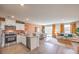 Open-concept living space features a modern kitchen and a connected living room at 4828 Lilac Ridge Ave # 26, Las Vegas, NV 89141