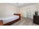 Comfortable bedroom with laminate floors and ensuite bathroom at 4869 S Torrey Pines Dr # 101, Las Vegas, NV 89103