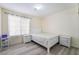This bedroom features neutral walls, wood floors, a sleek bed, and matching nightstands at 4869 S Torrey Pines Dr # 101, Las Vegas, NV 89103