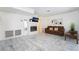 Inviting living room featuring a tiled fireplace, marble floors, and natural light at 4869 S Torrey Pines Dr # 101, Las Vegas, NV 89103