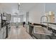 Modern kitchen with stainless steel appliances, granite countertops, and ample cabinet space at 4920 River Splash Ave, Las Vegas, NV 89131