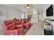 Cozy living room features tile flooring, comfortable seating, and ample natural light at 4920 River Splash Ave, Las Vegas, NV 89131