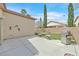 Spacious backyard featuring patio, seating, barbecue and adjacent lawn area at 4920 River Splash Ave, Las Vegas, NV 89131