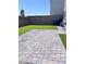 Backyard with artificial turf and patio pavers at 4993 Birchland Manor Ave, Las Vegas, NV 89139