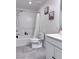 Bathroom featuring a tub, shower, toilet and vanity with clean, neutral colors and modern fixtures at 4993 Birchland Manor Ave, Las Vegas, NV 89139