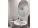 Half bathroom featuring pedestal sink, artwork and modern fixtures at 4993 Birchland Manor Ave, Las Vegas, NV 89139